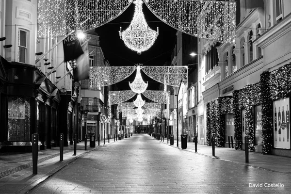 Grafton Street on Christmas Night empty and lit up with Christmas decoration.