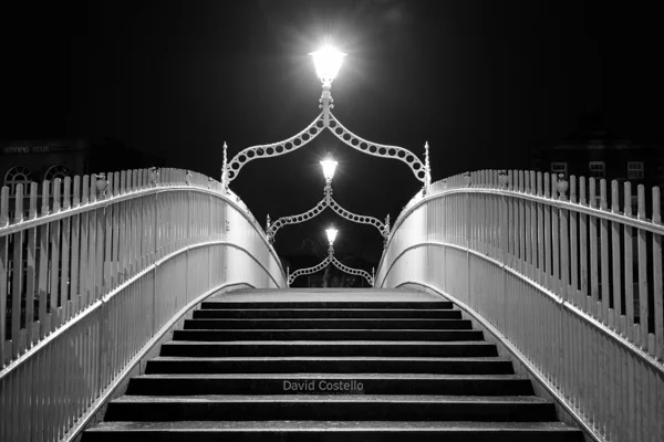 The Hapenny Bridge pictured in black and white on Christmas Day in Dublin.