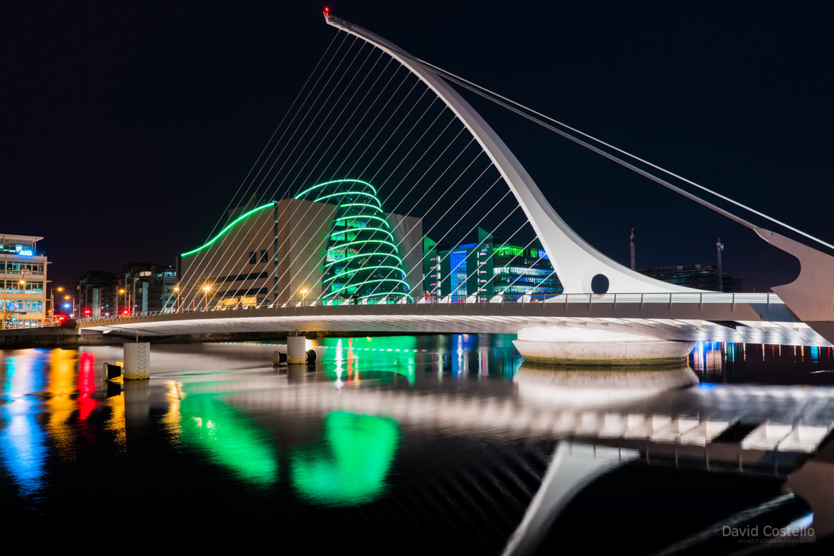 The Convention Centre lit in green for the Easter rising centenary in 2016, while Beckett Bridge reflects in the Liffey.