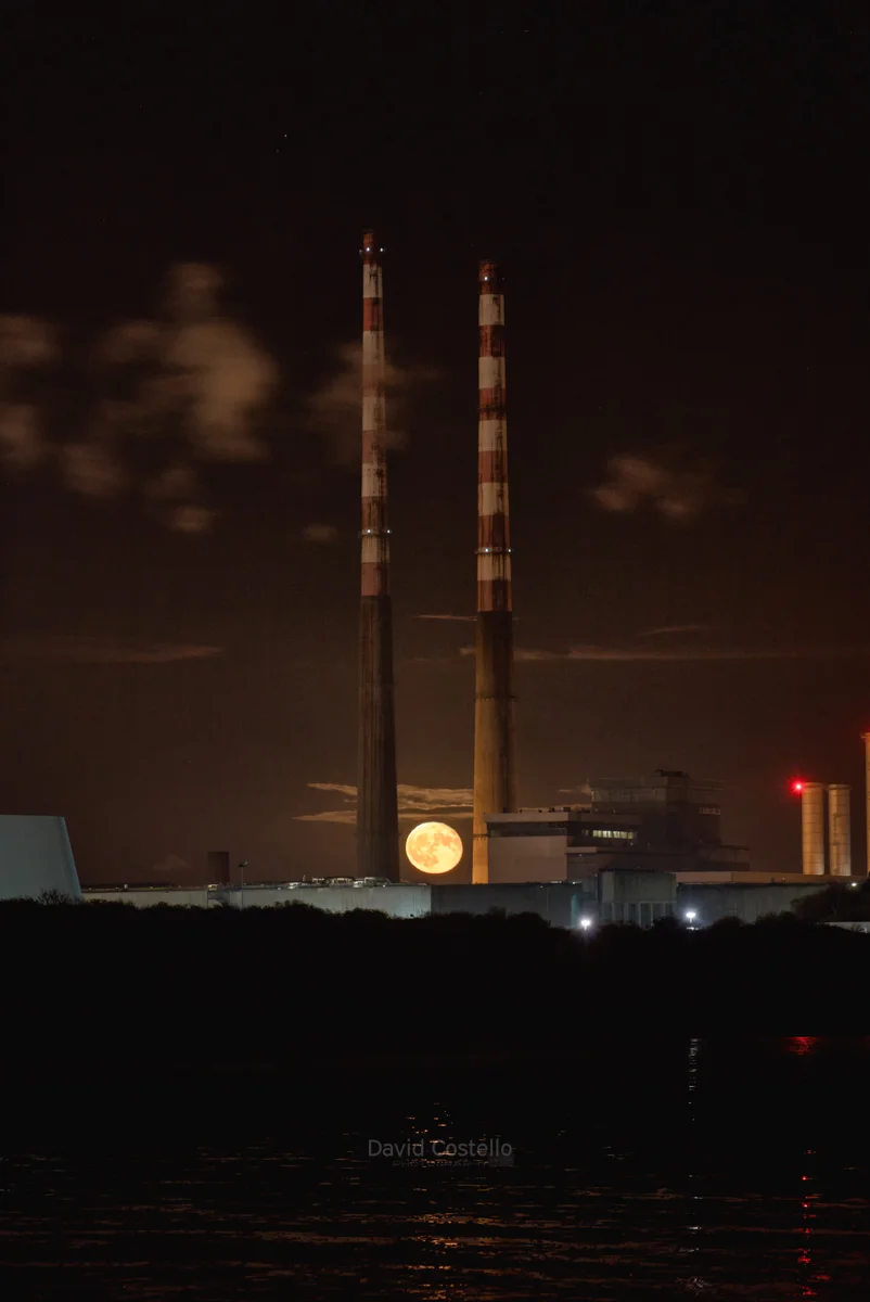 The Full Moon starts to rise between the Pigeon House Chimneys on a crisp clear autumn evening.