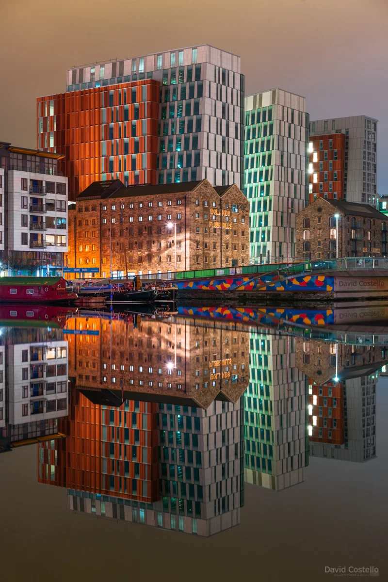 Grand Canal Dock on a peaceful winter night as the new Bolands Quay and old Bolands Mills buildings reflect in the water.