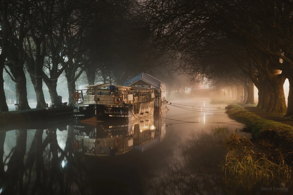 As the water turned to ice, the fog thickened and the barge lay still on the freezing Grand Canal in Dublin.