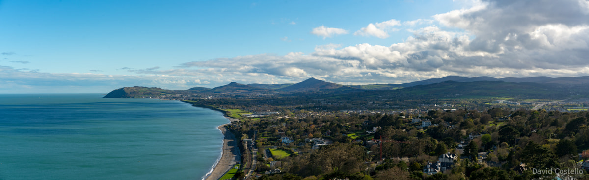 A panoramic view from Killiney hill, inward from the Irish sea past Bray Head and the Sugar Loaf towards Rathmichael wood.