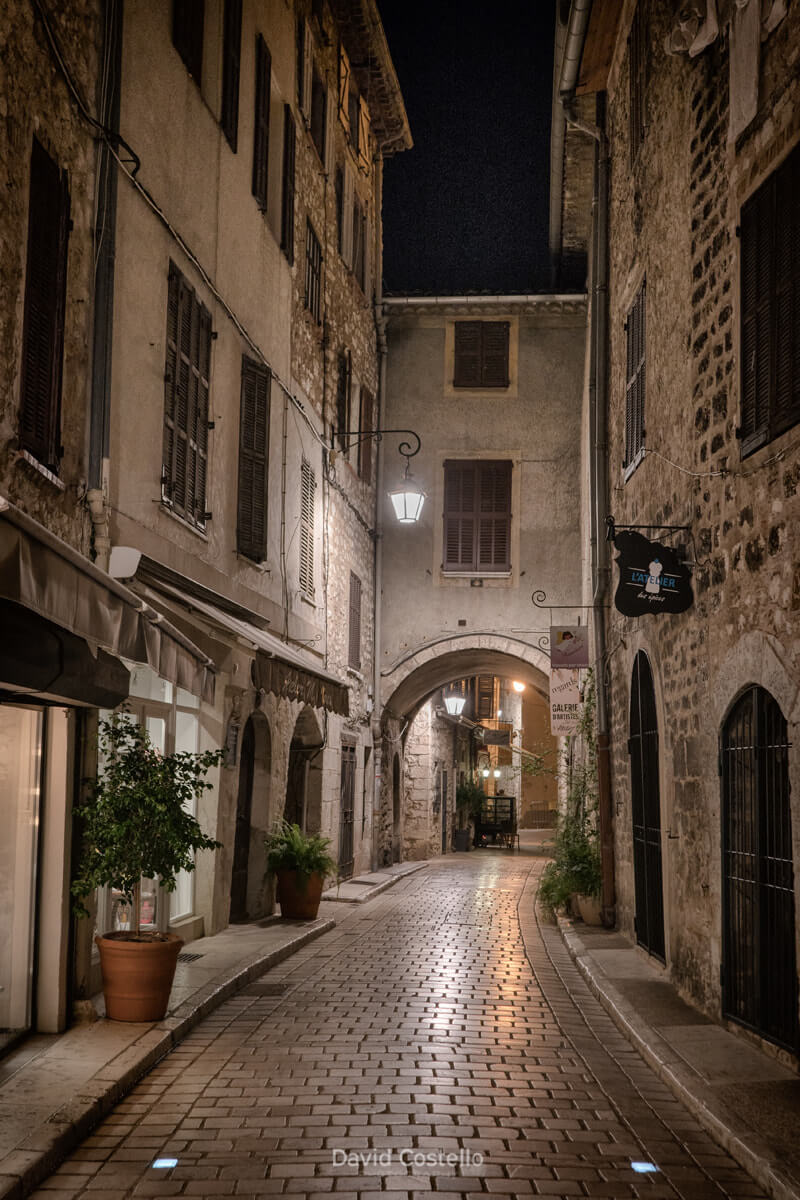 Looking along the beautiful Rue de l'Évêché at night in the medieval town of Vence, a stunning authentic commune in France.