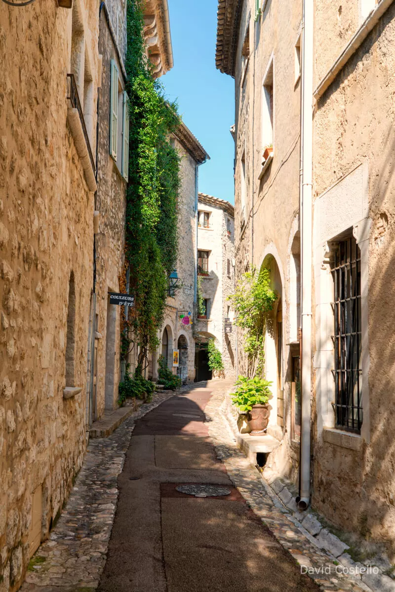 Rue Grande in Saint Paul de Vence on a beautiful sunny day without a person to be seen on the winding main street.