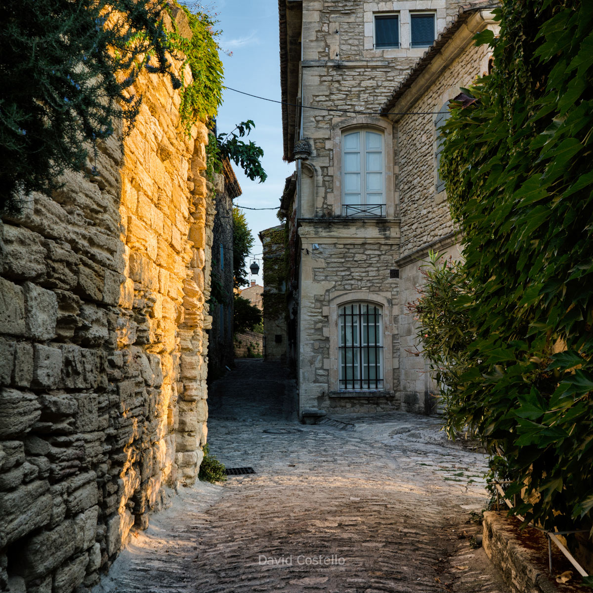 Crossing paths with the sun along cobbled streets that takes your breath away in Gordes.