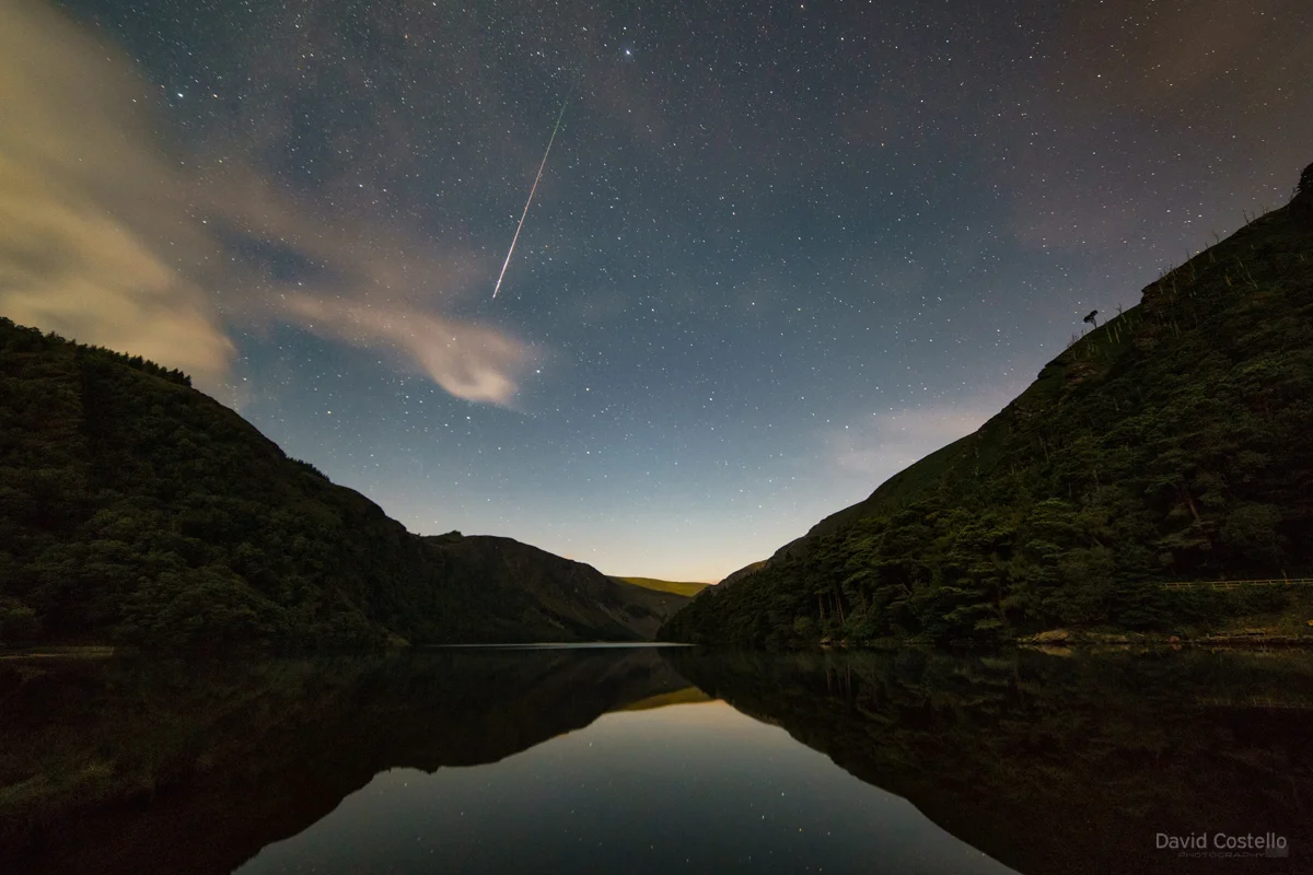 A Perseid Meteor streaks across the sky above Glendalough lake.