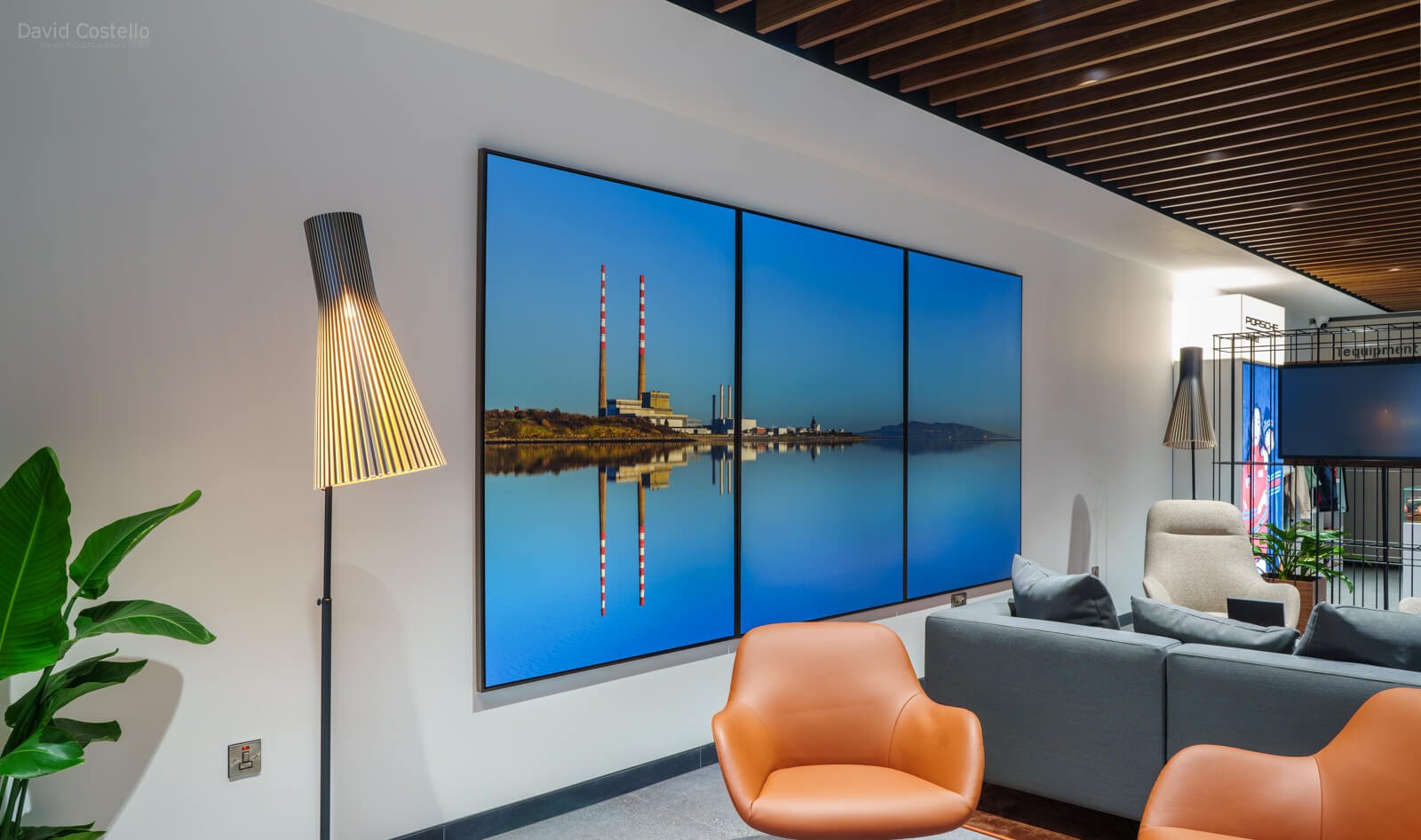 Large-format Poolbeg Chimneys triptych in bespoke floating tray frames installed at Porsche Centre South Dublin