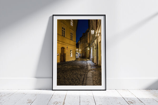 The Prague at Night print in a classic handmade black wooden frame.