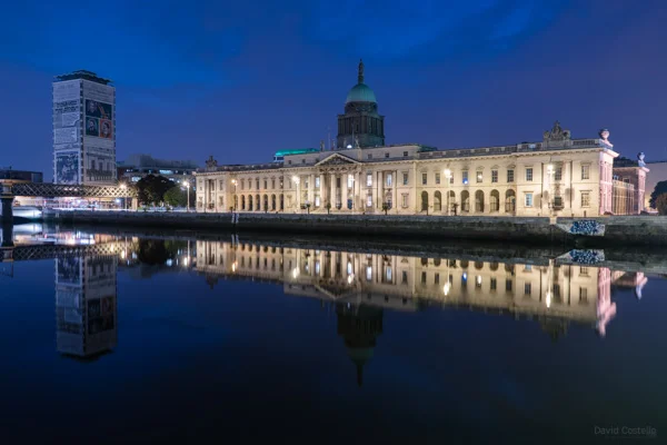 The Custom House and Liberty Hall reflecting on a mirror like river liffey.
