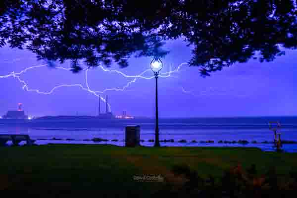 The Poolbeg Chimneys and Sandymount Strand are lit up by lightning as a thunderstorm passes through Dublin..
