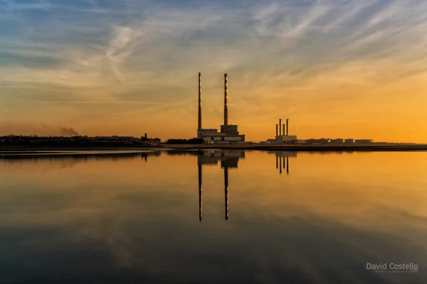 A perfect colourful reflection of the Poolbeg Chimneys on Dublin Bay at Sunrise.