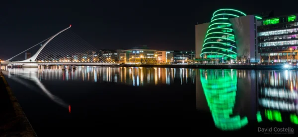 An easterly view of Beckett Bridge and The Convention Centre reflecting in the river Liffey.