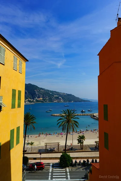 Looking from the steps of Basilique St Michel Archange over the beach in Menton towards the border and Italy.