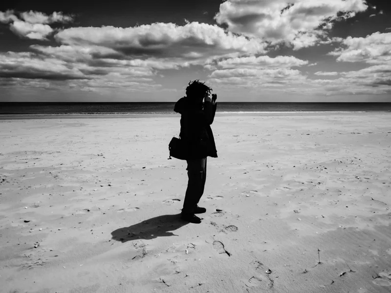 David Costello Photographer taking pictures on a beach.